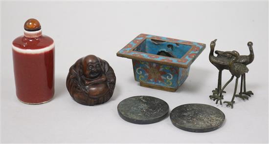 A bag of small items: Chinese cloisonne incense burner, two bronze mirrors, a porcelain snuff bottle,